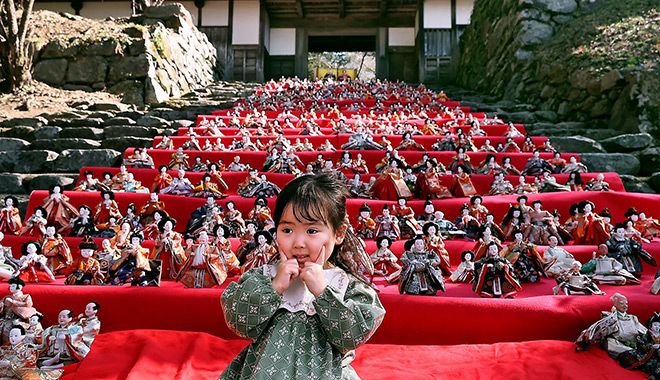 Hina dolls displayed on the stone steps of the Akizuki Castle ruins in Asakura, Fukuoka Prefecture