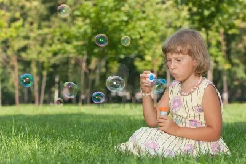 10277635alittlegirlisblowingbubblessitti-1.webp