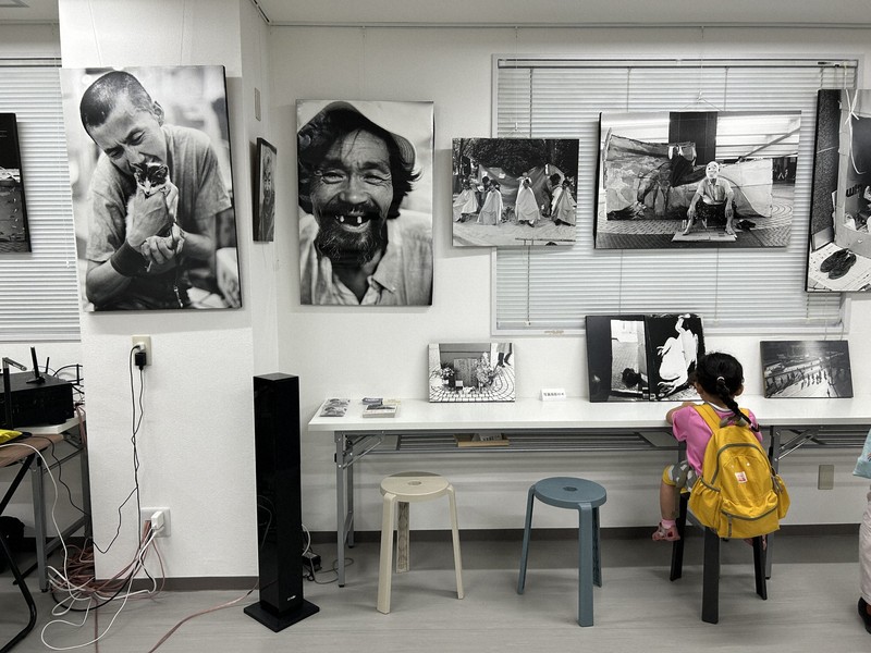 Photo by Sakokawa Naoko, a Shinjuku cardboard village photo exhibition in Tokyo in August 2025
