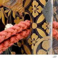 Red Braiding through lid of chest.webp
