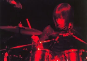 Tsukasa playing drums.webp