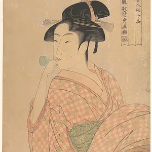 Young woman blowing a popen