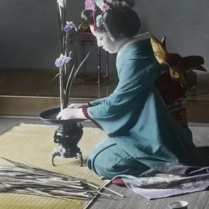 Arranging ikebana (hand colored)