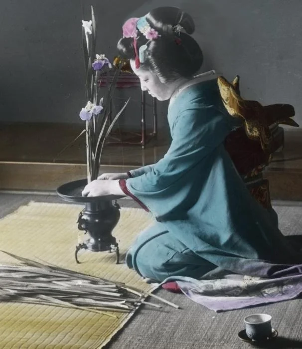 Arranging ikebana (hand colored)