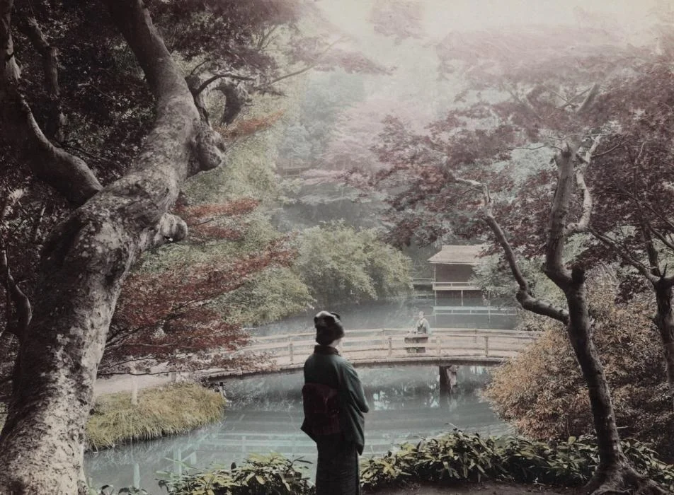 Woman in kimono near river (Hand-colored)